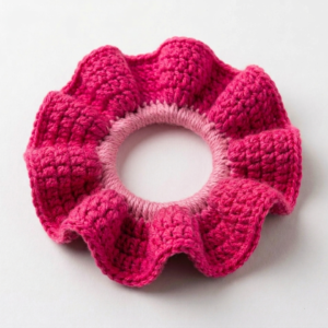 Coletero fucsia a crochet pequeño